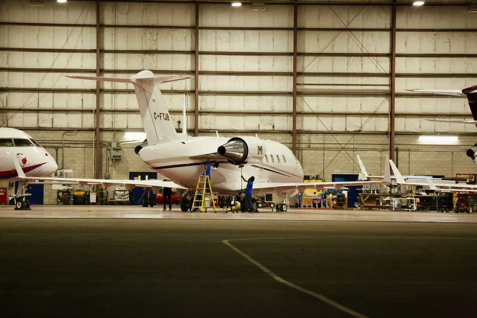 Business aircraft in a maintenance hangar