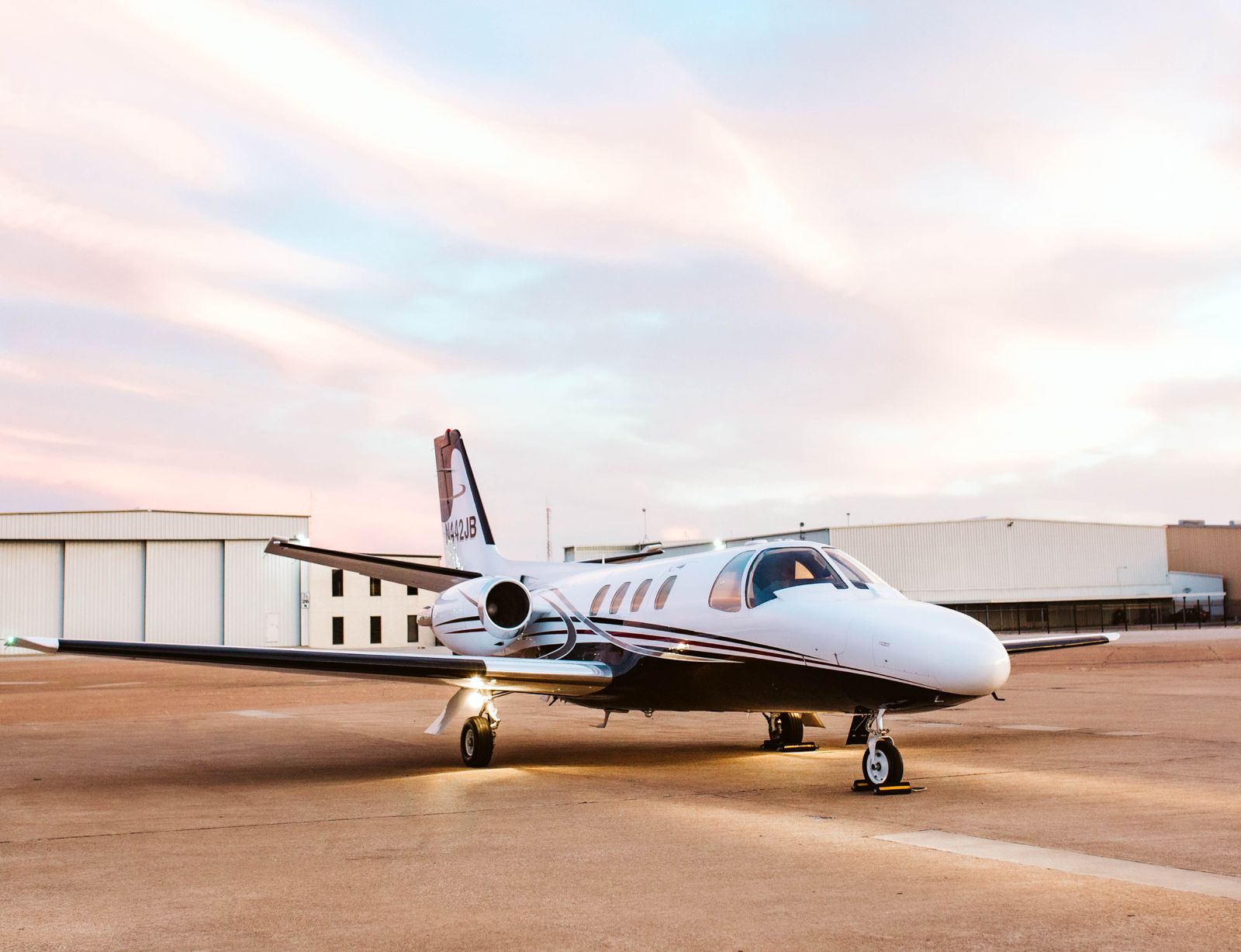 Business jet on the ramp at dusk